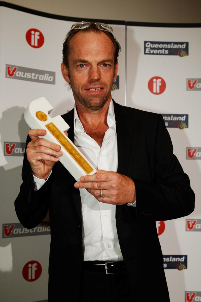 Hugo Weaving speaks to a TV reporter upon his arrival for the Tokyo premier  of his latest film V for Vendetta Monday, April 17, 2006. The political  action thriller, that stars Weaving