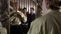 John Schneider (Gary Zimmerman) prepares his necktie for God in "Hidden Secrets."
