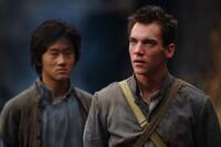 Guang Li as Shi Kai and Jonathan Rhys Meyers as George Hogg in "The Children of Huang Shi."