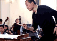 Tan Dun conducts a rehearsal of The First Emperor at an opera workshop in Shanghai in April 2006.