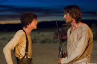 William Evans (Logan Lerman) and Dan Evans (Christian Bale) in "3:10 to Yuma."