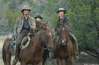 Dan Evans (Christian Bale) and his sons Mark Evans (Ben Petry) and William Evans (Logan Lerman) in "3:10 to Yuma."
