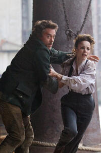 Robert Downey Jr. as Sherlock Holmes and Rachel McAdams as Irene Adler in 