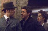 Jude Law as Dr. Watson, Robert Downey Jr. as Sherlock Holmes and Rachel Mcadams as Irene Adler in "Sherlock Holmes."