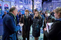 Director David Yates with Rupert Grint, Emma Watson and Daniel Radcliffe on the set of "Harry Potter and the Deathly Hallows: Part 1"