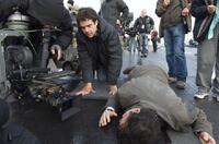 Director Tom Tykwer and Clive Owen as Louis Salinger on the set of "The International."
