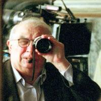 Director Claude Chabrol on the set of "A Girl Cut in Two."