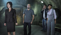Julie Benz as Brit, Carlo Rota as Charles, Greg Bryk as Mallick and Meagan Good as Luba in "Saw V."