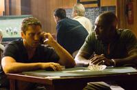 Gerard Butler as One Two and Idris Elba as Mumbles in "RocknRolla."
