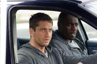 Gerard Butler as One Two and Idris Elba as Mumbles in "RocknRolla."