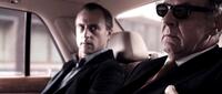 Mark Strong as Archie and Tom Wilkinson as Lenny in "RocknRolla."