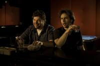 Brad William Henke as Denny and Sam Rockwell as Victor Mancini in "Choke."
