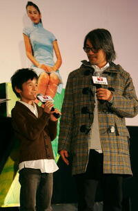 Actors Xu Jiao and Stephen Chow at a press conference in Beijing, China, to promote "CJ7."