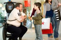 Kevin James as Paul Blart and Dylan Clark Marshall as Jacob in "Paul Blart: Mall Cop."