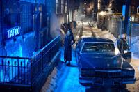 Mila Kunis as Mona Sax and Mark Wahlberg as Max Payne in "Max Payne."