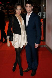 Iddo Goldberg and Guest at the European premiere of "Defiance."