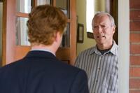 Christopher Carley as Father Janovich and Clint Eastwood as Walt Kowalski in "Gran Torino."