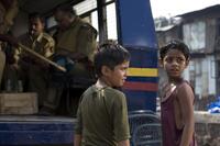 Ayush Mahesh Khedekar and Azharuddin Mohammed Ismail in "Slumdog Millionaire."