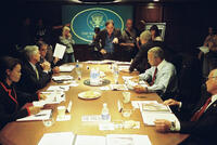 Director Oliver Stone (center), Thandie Newton as Condi Rice, Scott Glenn as Donald Rumsfeld, Bruce McGill as George Tenet, Josh Brolin as George W. Bush, Jeffrey Wright as Colin Powell and Richard Dreyfuss as Dick Cheney on the set of "W."