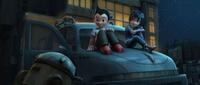 Astro Boy voiced by Freddie Highmore and Cora voiced by Kristen Bell in "Astro Boy."
