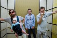 Zach Galifianakis as Alan holds Baby Tyler, Bradley Cooper as Phil and Ed Helms as Stu in "Hangover."