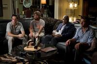 Ed Helms as Stu, Zach Galifianakis as Alan, Mike Tyson as himself and Bradley Cooper as Phil in "The Hangover."