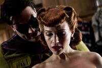 Jeffrey Dean Morgan as The Comedian and Carla Gugino as Silk Spectre in "Watchmen: The IMAX Experience."