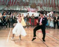 Olivia Newton-John as Sandy Olsson and John Travolta as Danny Zuko in "Grease Sing-a-long (2010)."