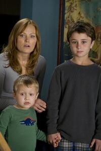 Malin Akerman as Ronnie, Colin Baiocchi as Kevin and Gattlin Griffith as Robert in "Couples Retreat."