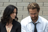 Carrie-Anne Moss and Ryan Reynolds in "Fireflies in the Garden."