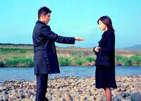 Masahiro Motoki as Daigo Kobayashi and Ryoko Hirosue as Mika Kobayashi in "Departures."