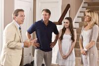 Nick Saban as himself, Tim McGraw as Sean Tuohy, Lily Collins as Collins and Sandra Bullock as Leigh Anne Tuohy in "The Blind Side."
