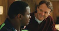 Quinton Aaron as Michael Oher and Tim McGraw as Sean Tuohy in "The Blind Side."