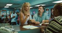 Sandra Bullock as Leigh Anne Tuohy and Maria Howell as CPS welfare worker in "The Blind Side."