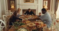 Lily Collins as Collins, Sandra Bullock as Leigh Anne Tuohy, Tim McGraw as Sean Tuohy, Jae Head as S.J. and Quinton Aaron as Michael Oher in "The Blind Side."