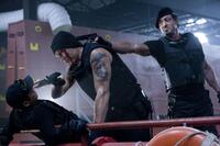 Jet Li as Yin Yang, Dolph Lundgren as Gunnar Jensen, Sylvester Stallone as Barney Ross in "The Expendables."