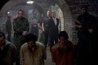 David Zayas as General Garza, Steve Austin as Dan Paine and Eric Roberts as James Monroe in "The Expendables."