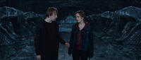 Rupert Grint as Ron Weasley and  Emma Watson as Hermione Granger in "Harry Potter and The Deathly Hallows: Part 2."