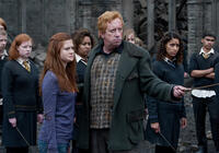 Bonnie Wright as Ginny Weasley and Mark Williams as Arthur Weasley in "Harry Potter and The Deathly Hallows: Part 2."