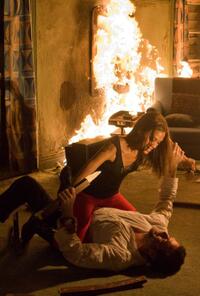 Zoe Saldana as Aisha and Jeffrey Dean Morgan as Clay in "The Losers."