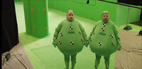 Tweedles Progression 1 of 6: To start the shot of the Tweedles in the Red Queen's throne room, Matt Lucas (left) is photographed on the green-screen stage wearing the "Tweedle suit."