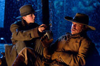 Hailee Steinfield as Mattie Ross and Matt Damon as La Boeuf in "True Grit"