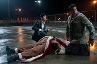 John Cho as Harold, Kal Penn as Kumar and Richard Riehle as Santa Claus in "A Very Harold & Kumar Christmas."