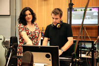 Director Sarah Smith works and composer Harry Gregson-Williams on the set of "Arthur Christmas."