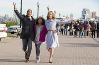 Jamie Foxx as Stacks, Quvenzhane Wallis as Annie and Rose Byrne as Grace in "Annie."