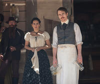 Ana de la Reguera and Sam Rockwell as Doc in "Cowboys & Aliens."