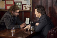 Bradley Cooper as Eddie Morra and Johnny Whitworth as Vernon Gant in "Limitless."
