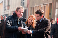 Director John Madden, Jessica Chastain and Sam Worthington on the set of "The Debt."