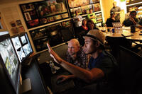 Director Dan Scanlon, artist Paul Abadilla on the set of "Monsters University."