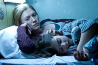 Mireille Enos as Karin Lane and Sterling Jerins as Constance Lane in "World War Z."